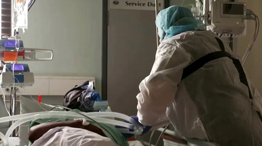 A nurse from South Africa takes care of a patient infected with Corona virus