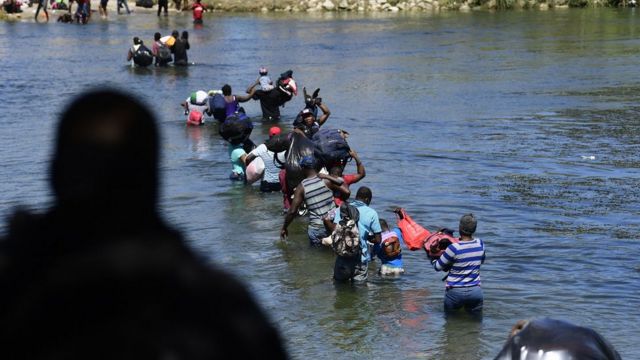 Haitians cross the Rio Grande