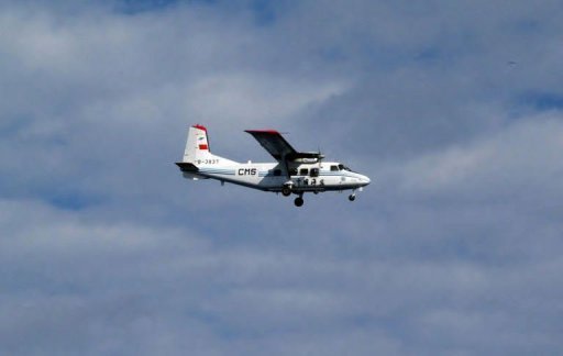 The Chinese plane flies over the disputed Senkaku or Diaoyu Islands in the East China Sea